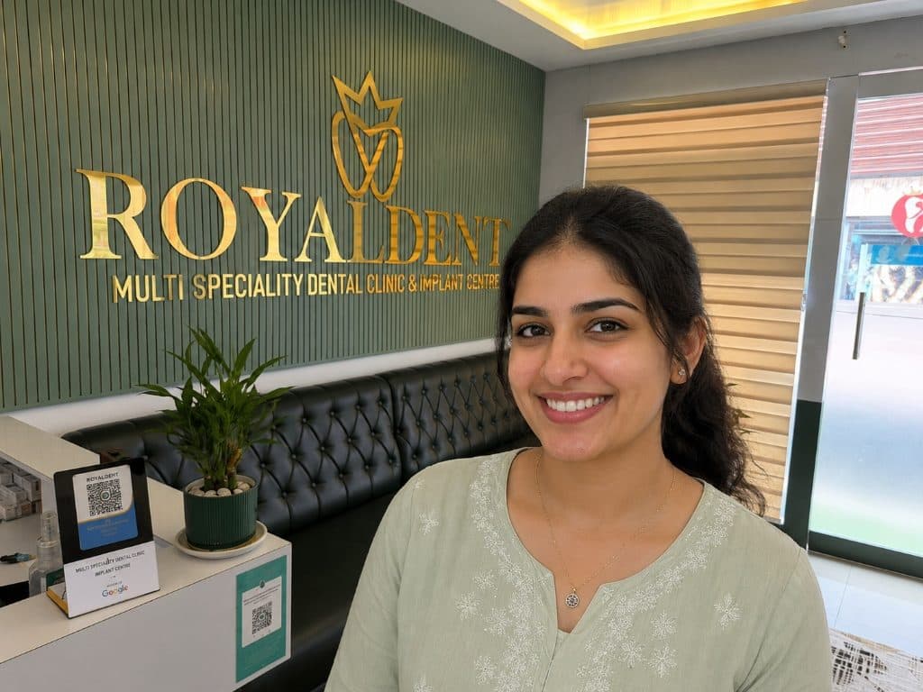 Happy patient with a healthy confident smile at Royaldent Vadakara